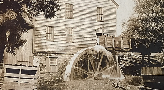 schooley mill barn and water wheel in the 1800s in Waterford VA